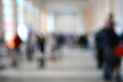 Blurred background many people inside the building