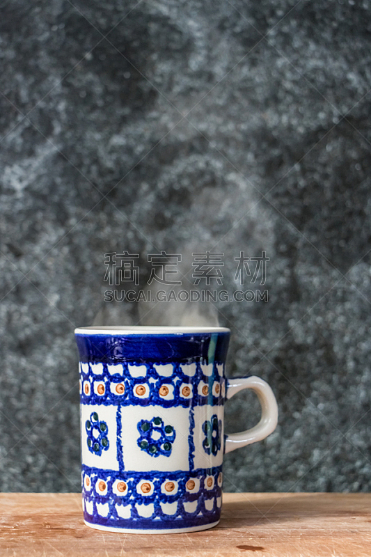 Blue mug on wooden surface