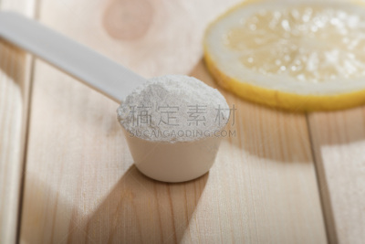 Sport supplement or vitamin with a lemon slice. Sport nutrition concept.