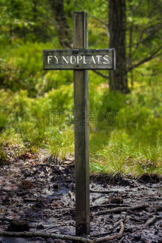 Sign post stating "Fyndplats" aka Bargain place. Public sign post in the wood where´s the finding of Bockstensmannen (The Bockstens man) wich occured in Halland Sweden 1936.