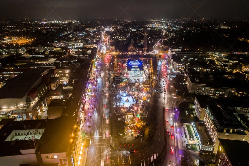 Aerial view of Hamburg at night, Germany. Christmas time. Wandsbek station. City traffic. Christmas decorations. Aerial footage. Night.