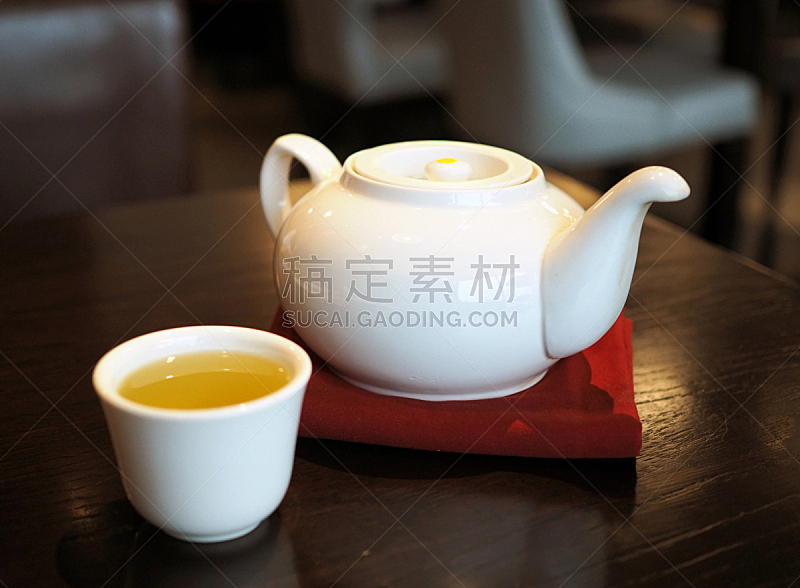 White Chinese teapot and tea cup.
