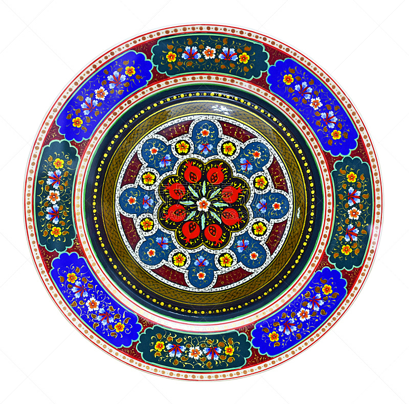 Eastern carved, colored ornament on a wooden plate