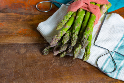 Green young asparagus shoots â premium healtry food, ready to cook and for grill