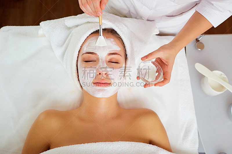 Woman in mask on face in spa salon