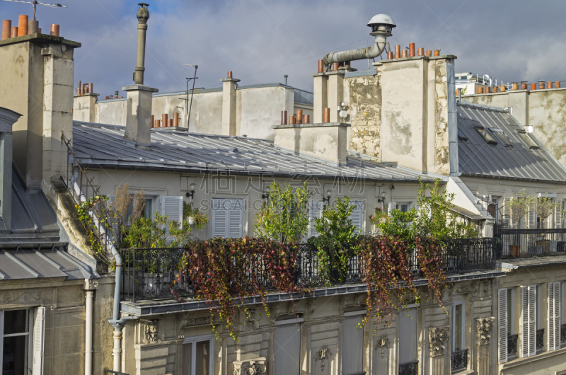 Balcony, decorated with flowers and small shrubsÑ