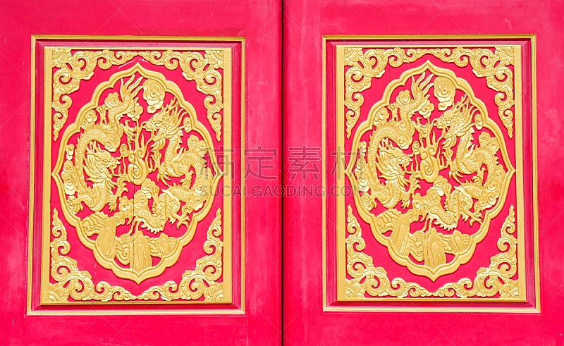 Golden dragon decorated on red wood wall