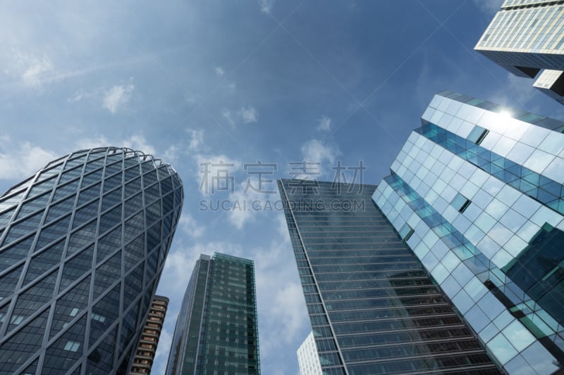 Skyscrapers in Paris business district La Defense. Cityscape with glass facades of modern buildings on a sunny day. Urban architecture and contemporary city life. Economy, financial activity concept