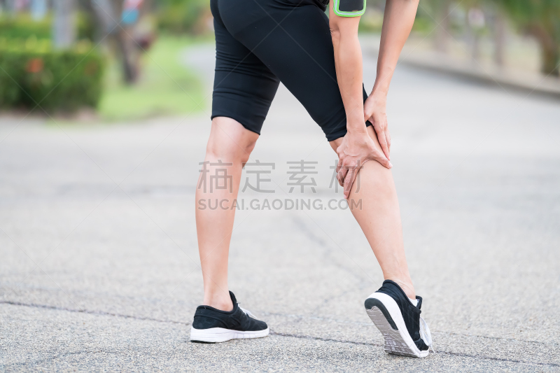 woman runner sports injured leg . Pain relief concept