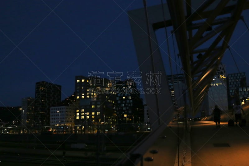 Oslo, Norway – July 21, 2018: Akrobaten pedestrian bridge in Bjorvika district at night.