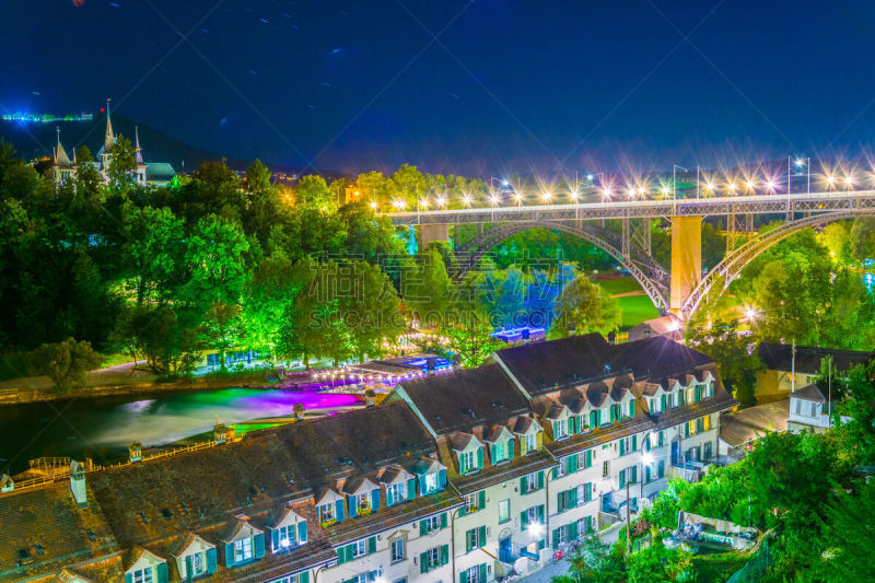 Night view over Museum of History and Kirchenfledbrücke bridge over river Aare in Bern, Switzerland