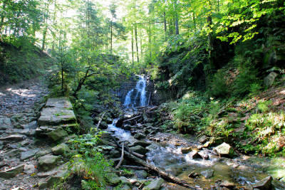 Waterfall of Biała Wisełka river next to the mountain trail to Barania Góra in Beskidy Mountains in Poland.