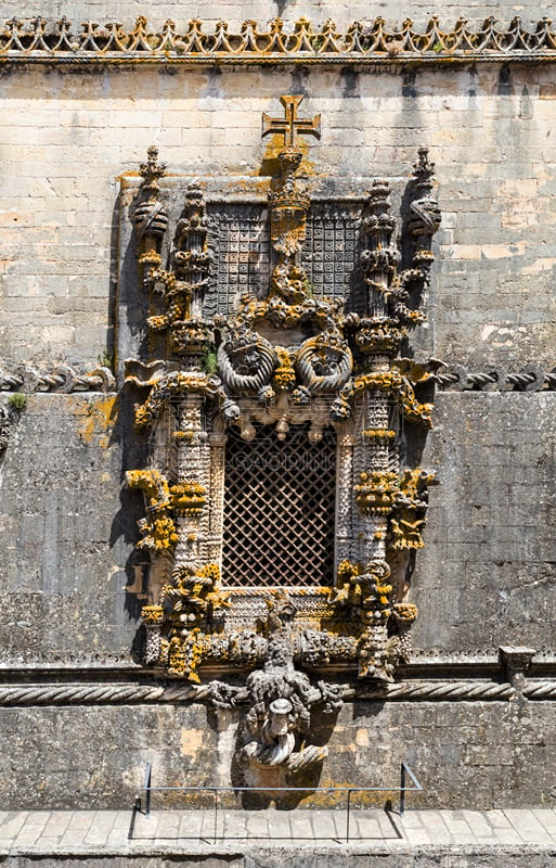 Detail of the delicate and intricate carvings of the Manueline window on the western façade of the Convent of Christ, in Tomar, Portugal