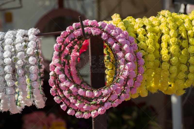 colorful crowns made of fake flowers