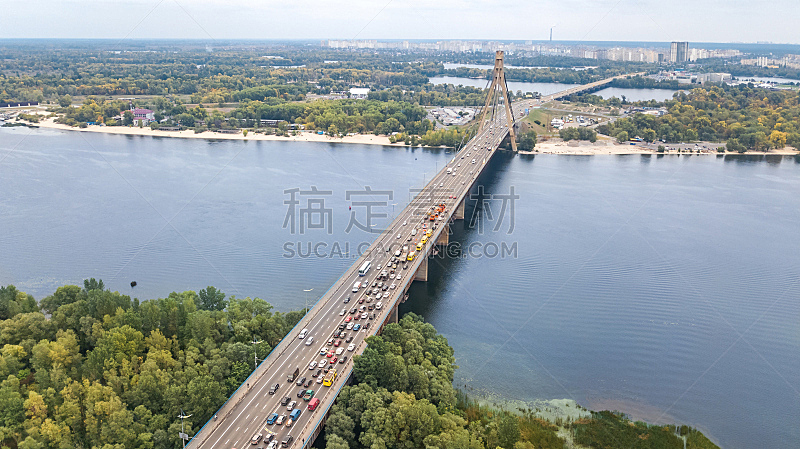 Aerial top view of bridge road automobile traffic jam of many cars from above, block and road repair, city transportation concept