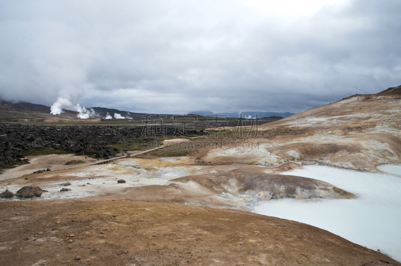 Hverarönd, Iceland. Hot vapors in a typical Icelandic landscape, a wild nature of rocks and shrubs, rivers and lakes.