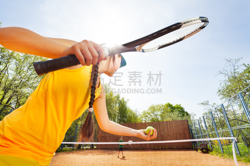 Low angle view of tennis player against blue sky