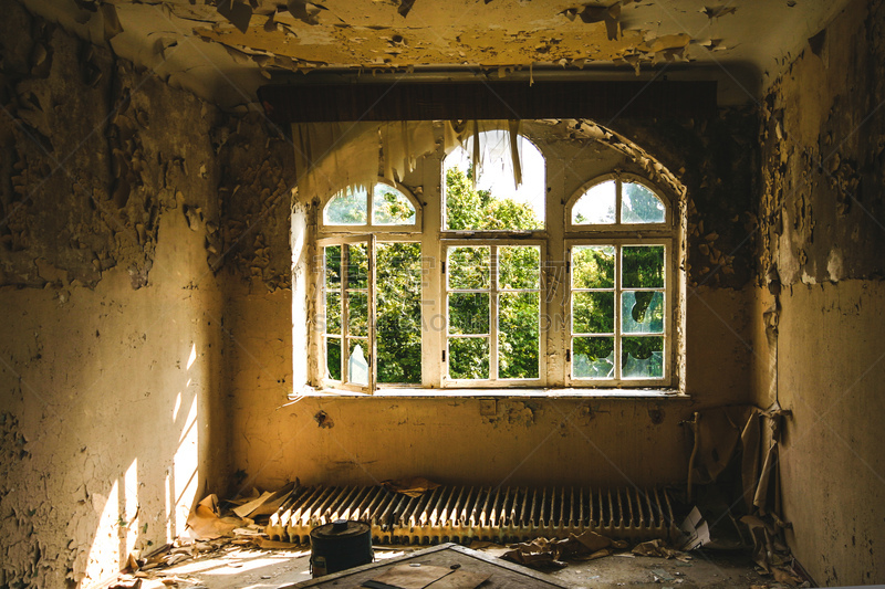 an old room with destroyed windows in an abandoned place at beelitz Heilstätten