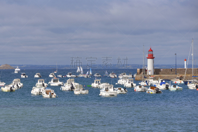 Port and lighthouse at high tide of Erquy, a commune in the Côtes-d'Armor department of Brittany in northwestern France on the côte de Penthièvre.
