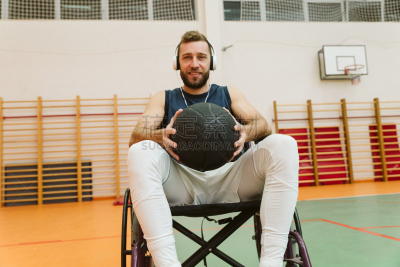 Man in wheelchair playing basketball