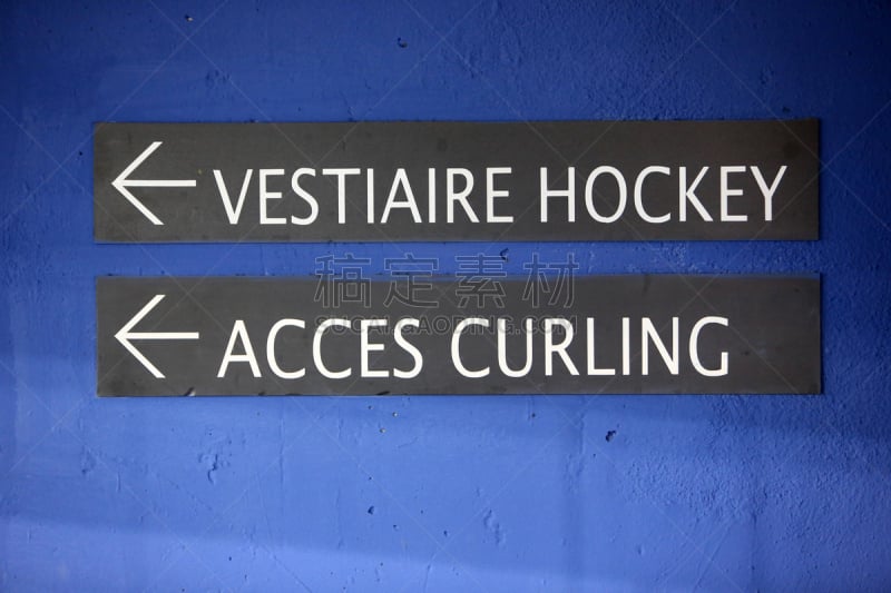 France. Auvergne-Rhône-Alpes. Haute-Savoie. 11/19/2016. This colorful image depicts a sign on a door indicating the hockey cloakroom and curling access.