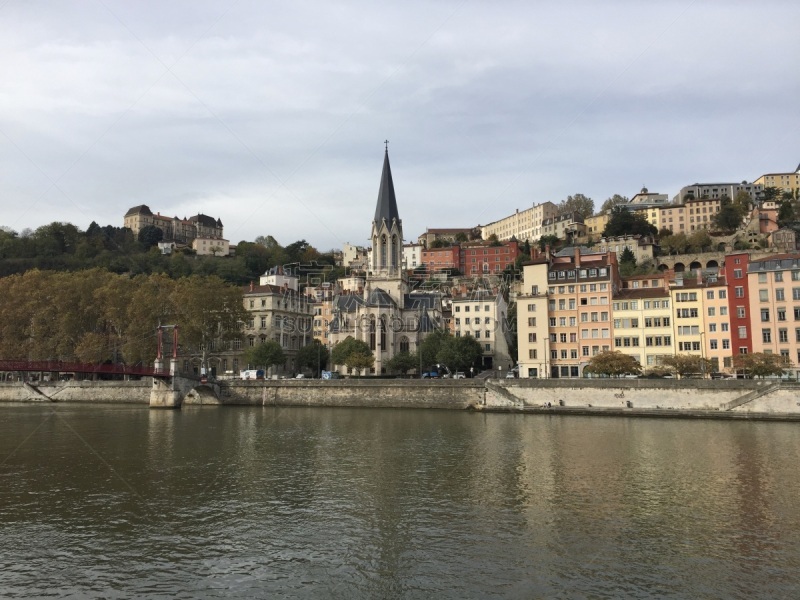 The Saint-Georges Roman Catholic church, the Paul Couturier bridge and quays of the Saône river in Lyon, France