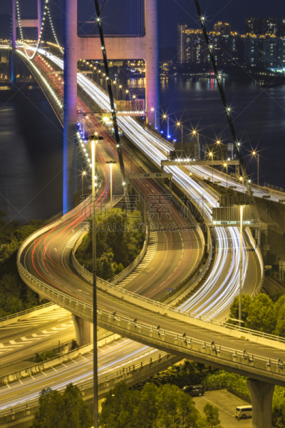 Blurred Traffic Light Trails on Bridge at Night