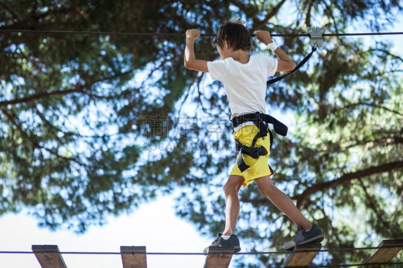 Little boy in adventure park