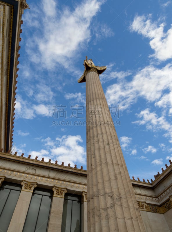 The building of the Athens Academy a marble column with a sculptures of Apollo and Athena, Socrates and Plato against a with clouds in Athens, Greece