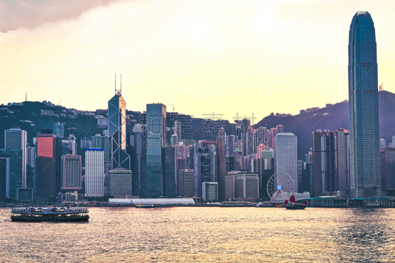 Star ferry at Victoria Harbor of Hong Kong at sunset