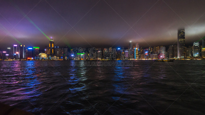 Wide night panorama of Hong Kong skyline during Symphony of Lights, a show featuring, lights, LED, lasers and sounds displayed every night at 8 pm