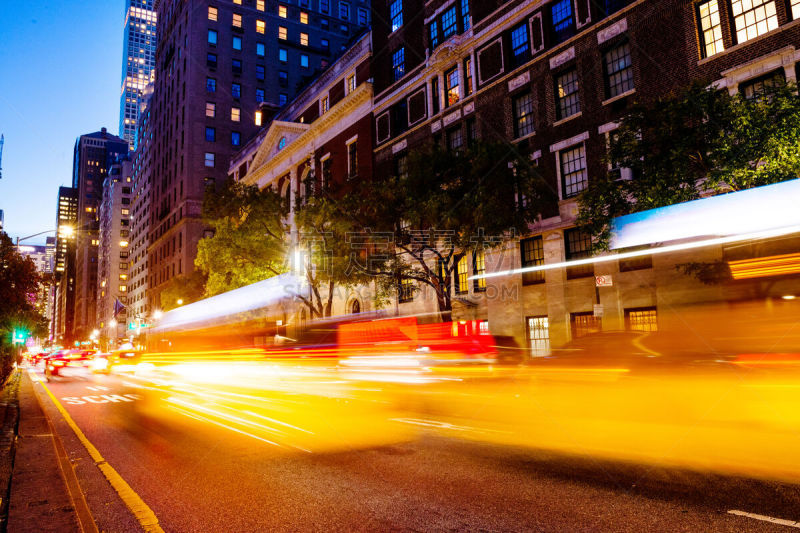 This is a long exposure photograph motion blurring traffic on Park Avenue in Manhattan’s Upper East of New York City at night.