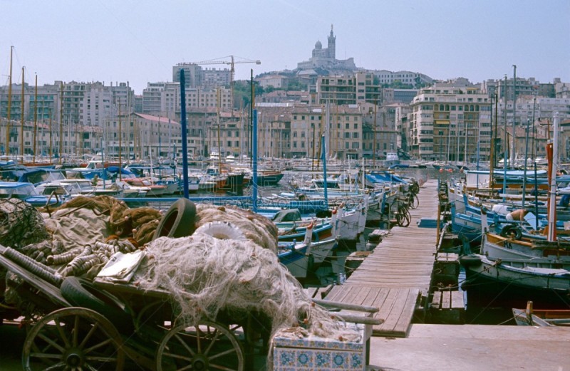Bouches-du-Rhône, France, 1976. The port of Marseille with its fishing boats and houses.