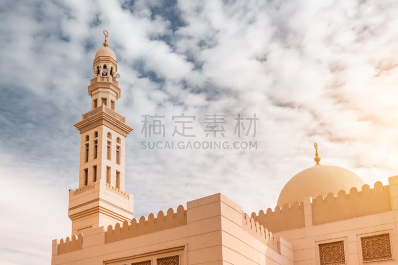 Close-up shot of minaret and dome of a typical mosque in arabian country