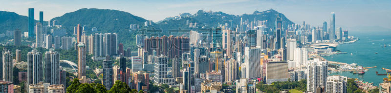 Hong Kong aerial panorama over harbour skyscrapers crowded cityscape China