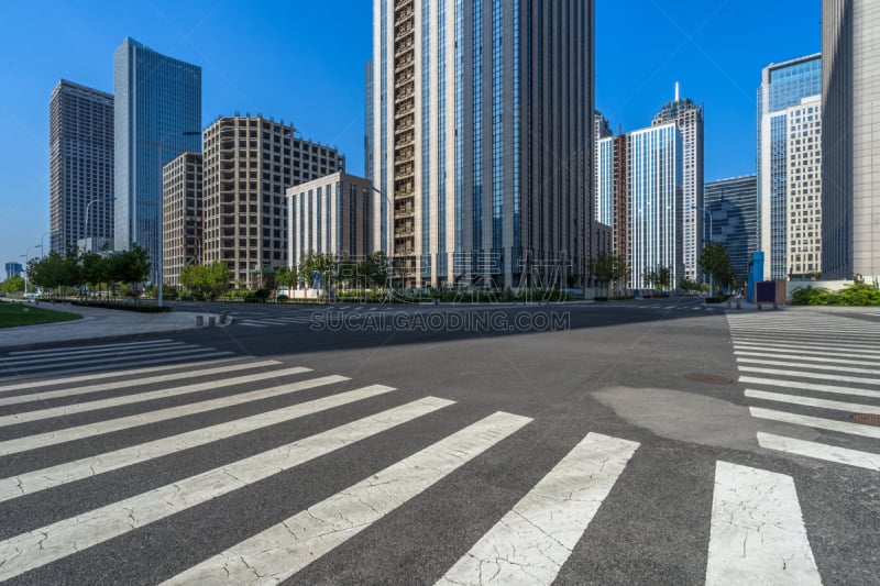 empty road with zebra crossing and skyscrapers in modern city