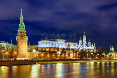 Illuminated Moscow Kremlin with Grand Kremlin Palace the government residence of president of Russia. View from the embankment of Moskva river. Evening urban landscape in the blue hour